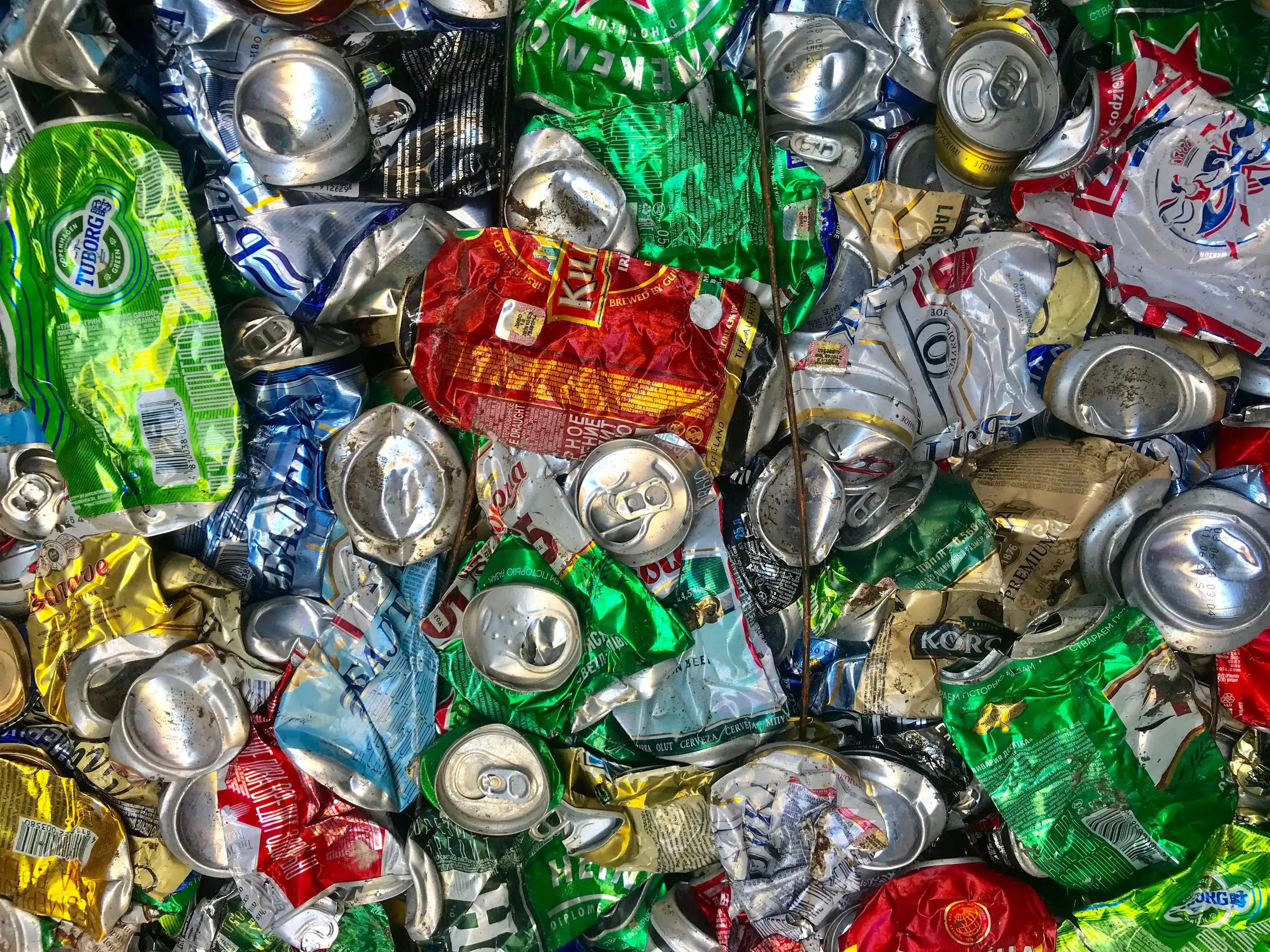 Crushed aluminum drink cans packed together
