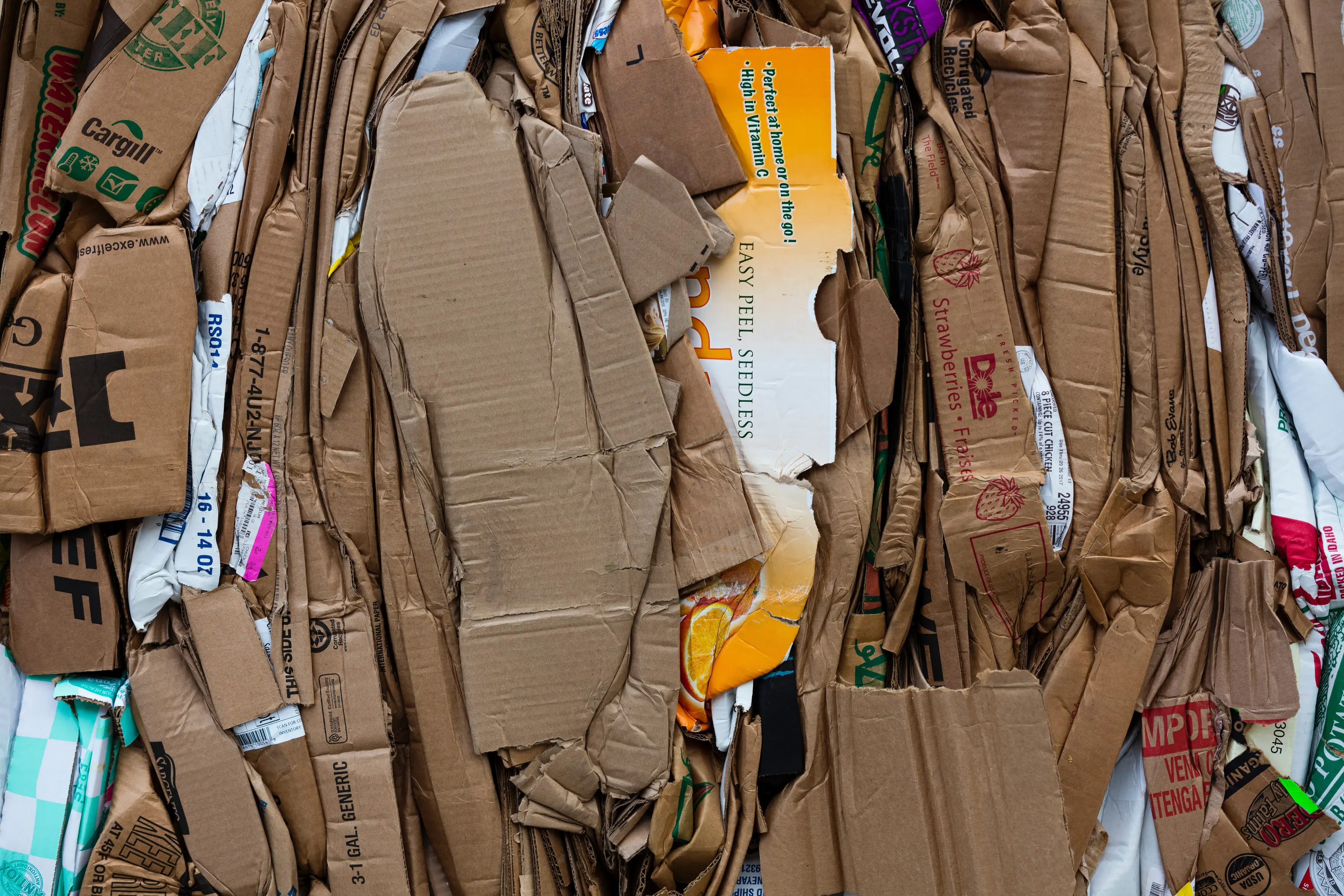 Flattened cardboard boxes compressed into a bale